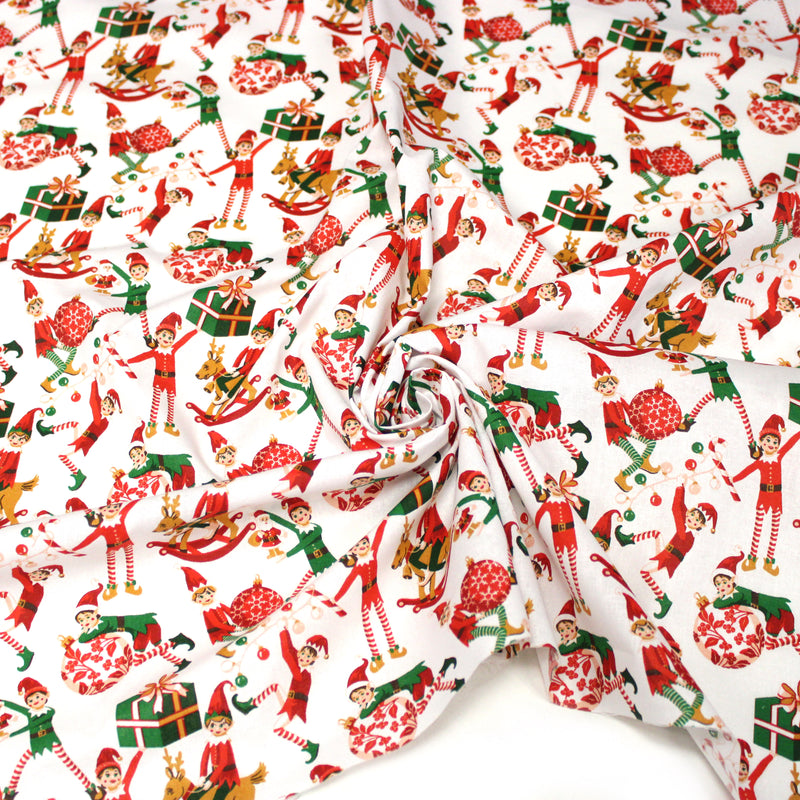 Tissu cotonnade de NOËL – La farandole des lutins, fond blanc - OEKO-TEX STANDARD 100 - tissuspipi.com