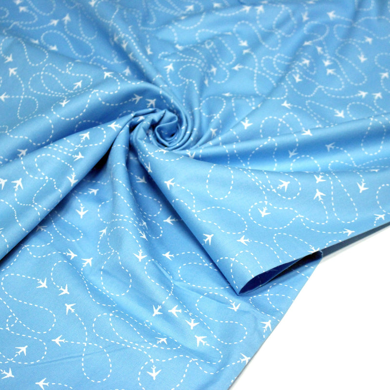 Tissu popeline coton bleu aux avions et lignes de vol, collection VOYAGE - tissuspipi.com