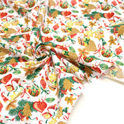 Tissu cotonnade de NOËL – Gnomes et douceurs de fête, fond blanc - OEKO-TEX STANDARD 100 - tissuspipi.com