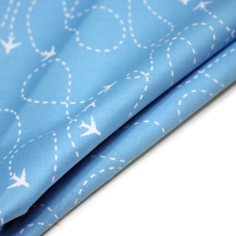 Tissu popeline coton bleu aux avions et lignes de vol, collection VOYAGE - tissuspipi.com