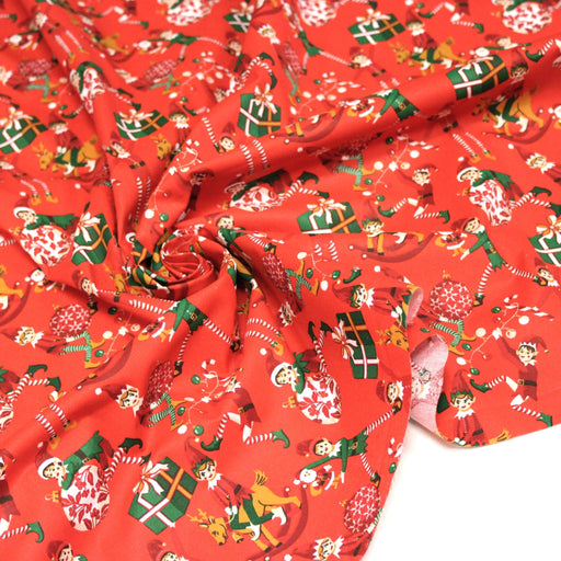 Tissu cotonnade de NOËL – La farandole des lutins, fond rouge - OEKO-TEX STANDARD 100 - tissuspipi.com