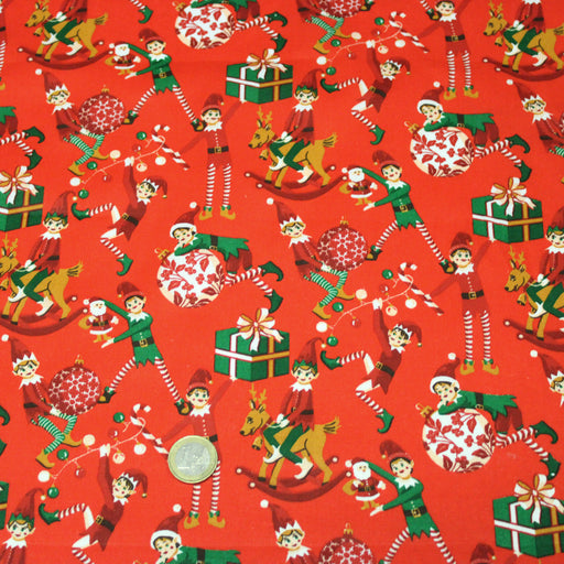 Tissu cotonnade de NOËL – La farandole des lutins, fond rouge - OEKO-TEX STANDARD 100 - tissuspipi.com