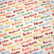 Tissu popeline coton blanc aux noms de ville multicolores, collection VOYAGE - tissuspipi.com