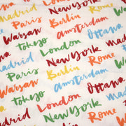 Tissu popeline coton blanc aux noms de ville multicolores, collection VOYAGE - tissuspipi.com