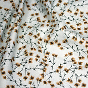 Tissu popeline coton, bleu ciel aux fines fleurs ocre et tiges vertes - Collection britannique - tissuspipi.com