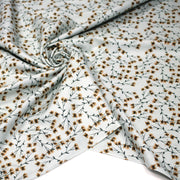 Tissu popeline coton, bleu ciel aux fines fleurs ocre et tiges vertes - Collection britannique - tissuspipi.com