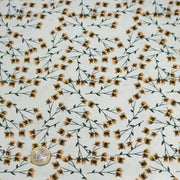 Tissu popeline coton, bleu ciel aux fines fleurs ocre et tiges vertes - Collection britannique - tissuspipi.com