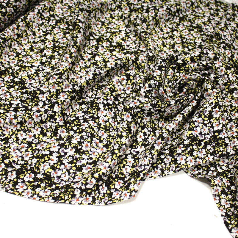 Tissu Viscose crêpe noir fleuri jaune blanc violet orange - tissuspipi.com