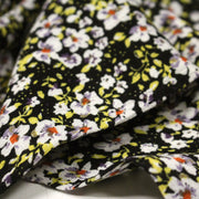 Tissu Viscose crêpe noir fleuri jaune blanc violet orange - tissuspipi.com