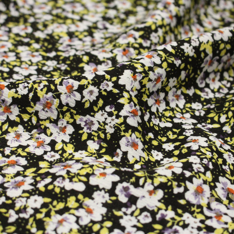 Tissu Viscose crêpe noir fleuri jaune blanc violet orange - tissuspipi.com