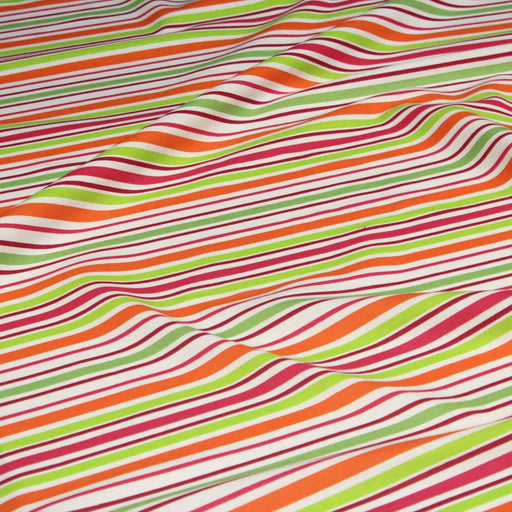 Tissu Bayadère de coton aux rayures oranges, rouges et roses, fond blanc - tissuspipi.com