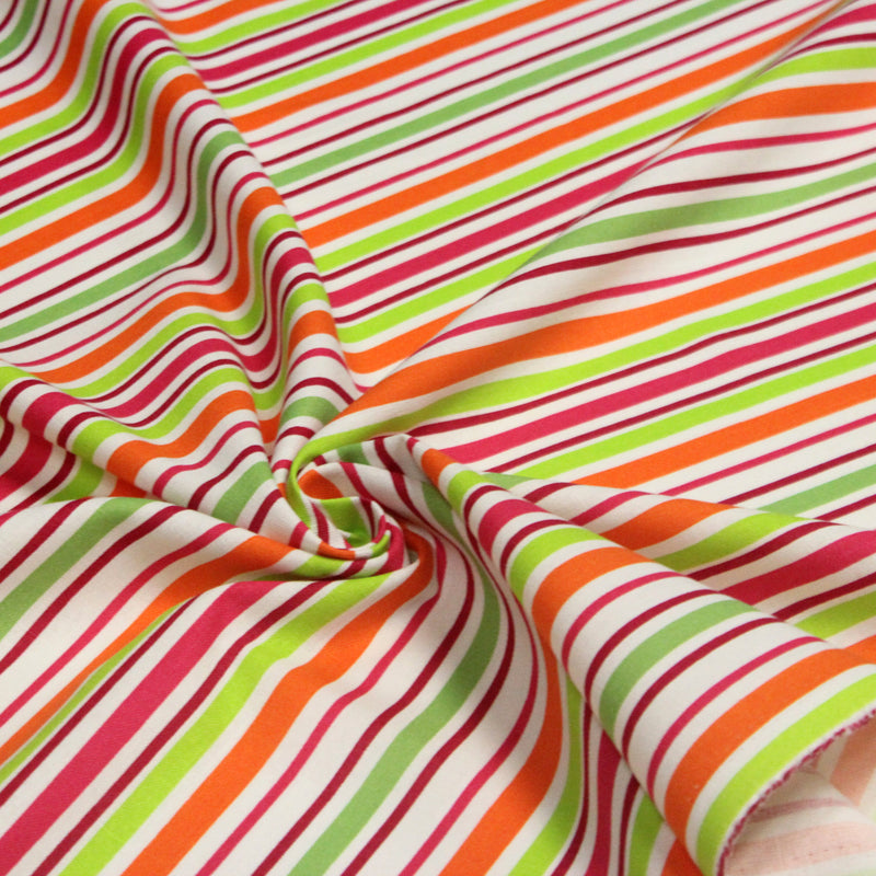 Tissu Bayadère de coton aux rayures oranges, rouges et roses, fond blanc - tissuspipi.com