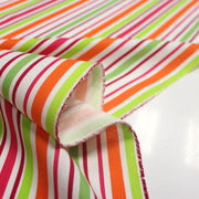 Tissu Bayadère de coton aux rayures oranges, rouges et roses, fond blanc - tissuspipi.com