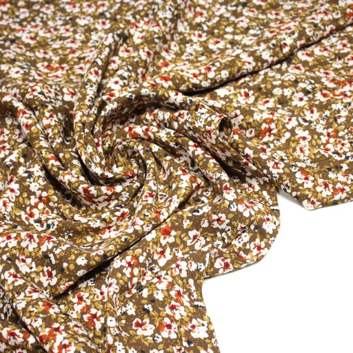 Tissu Viscose crêpe ocre fleuri blanc rouille noir - tissuspipi.com