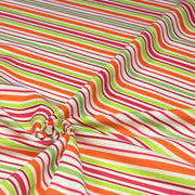 Tissu Bayadère de coton aux rayures oranges, rouges et roses, fond blanc - tissuspipi.com