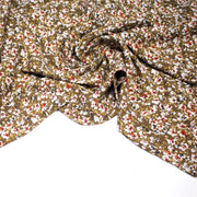 Tissu Viscose crêpe ocre fleuri blanc rouille noir - tissuspipi.com