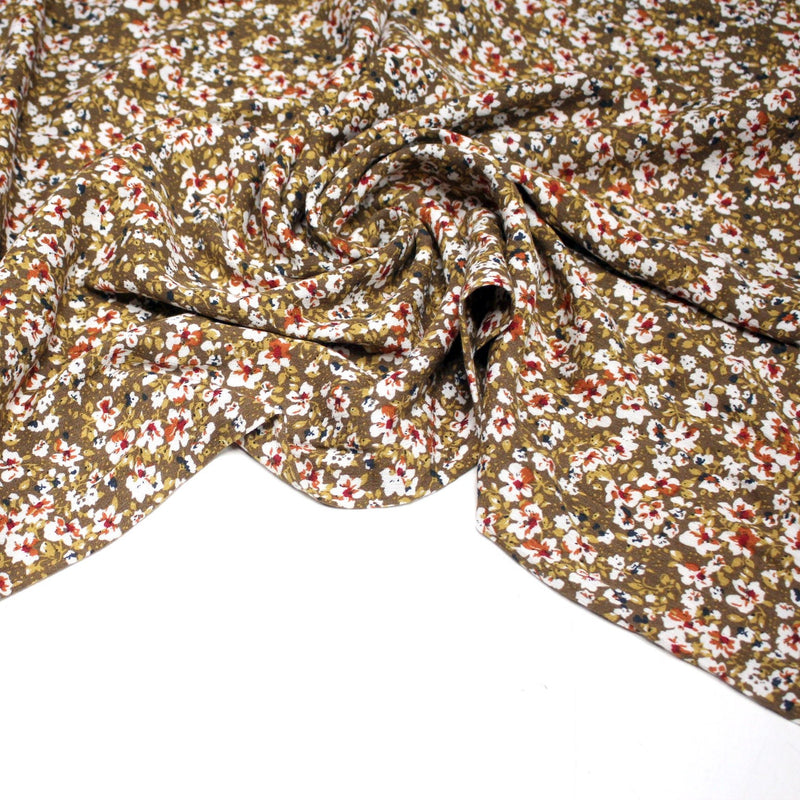 Tissu Viscose crêpe ocre fleuri blanc rouille noir - tissuspipi.com