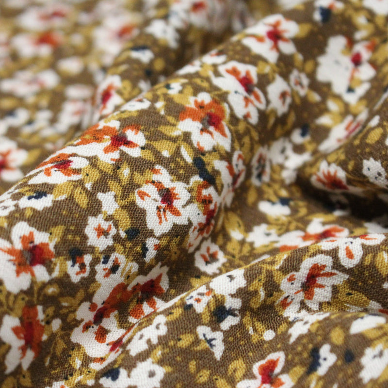Tissu Viscose crêpe ocre fleuri blanc rouille noir - tissuspipi.com