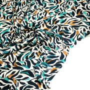 Tissu Viscose fluide au feuillage marine canard et ocre, fond écru - tissuspipi.com