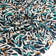 Tissu Viscose fluide au feuillage marine canard et ocre, fond écru - tissuspipi.com