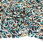 Tissu Viscose fluide au feuillage marine canard et ocre, fond écru - tissuspipi.com