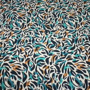 Tissu Viscose fluide au feuillage marine canard et ocre, fond écru - tissuspipi.com