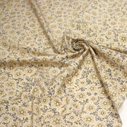Tissu popeline coton ocre clair aux fleurs & fines arabesques noirs et jaunes - tissuspipi.com