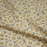 Tissu popeline coton ocre clair aux fleurs & fines arabesques noirs et jaunes - tissuspipi.com