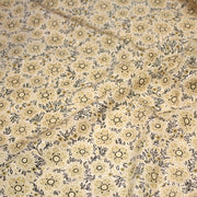 Tissu popeline coton ocre clair aux fleurs & fines arabesques noirs et jaunes - tissuspipi.com
