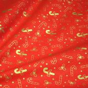 Tissu coton NOËL rouge aux houx et sucres d'orge dorés - OEKO - TEX - tissuspipi.com