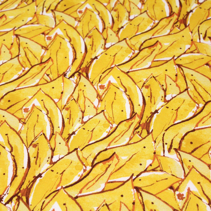 Tissu popeline de coton SUMATRA au feuillage tropical jaune, fond blanc - tissuspipi.com