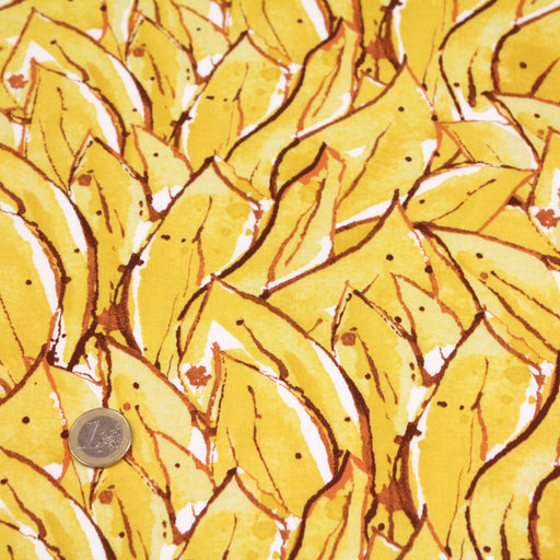 Tissu popeline de coton SUMATRA au feuillage tropical jaune, fond blanc - tissuspipi.com
