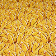 Tissu popeline de coton SUMATRA au feuillage tropical jaune, fond blanc - tissuspipi.com