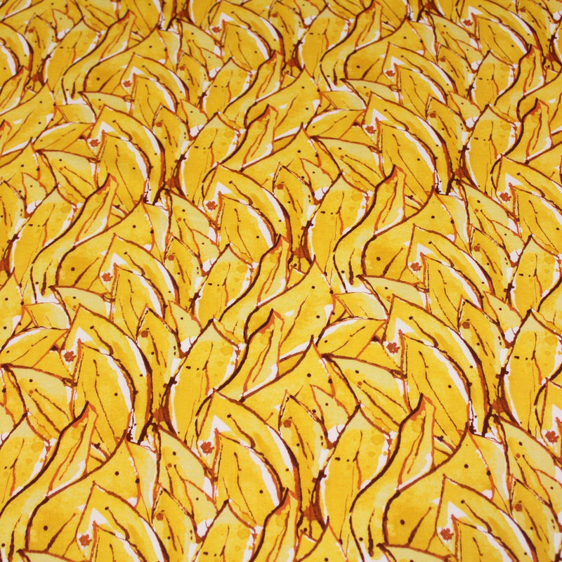 Tissu popeline de coton SUMATRA au feuillage tropical jaune, fond blanc - tissuspipi.com