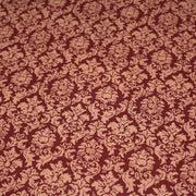 Tissu popeline de coton aux arabesques caramel, fond rouge bordeaux - COLLECTION LOUIS - tissuspipi.com