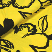 Tissu jersey de viscose jaune aux grandes fleurs noires - COLLECTION ETHNIQUE - tissuspipi.com