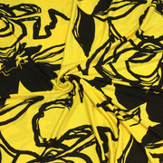 Tissu jersey de viscose jaune aux grandes fleurs noires - COLLECTION ETHNIQUE - tissuspipi.com