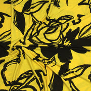 Tissu jersey de viscose jaune aux grandes fleurs noires - COLLECTION ETHNIQUE - tissuspipi.com