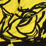 Tissu jersey de viscose jaune aux grandes fleurs noires - COLLECTION ETHNIQUE - tissuspipi.com