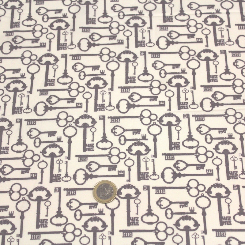 Tissu popeline de coton aux clefs vintage taupe, fond écru - tissuspipi.com