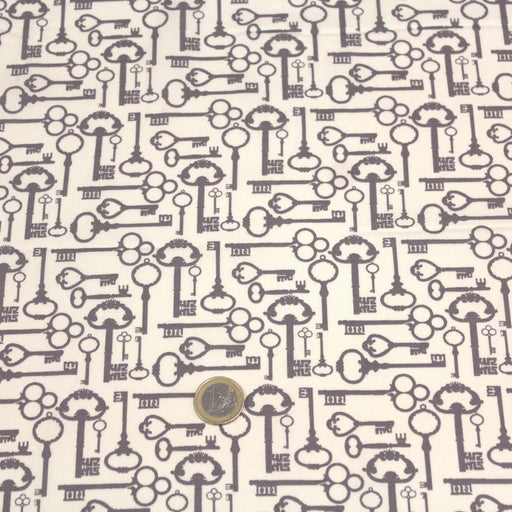 Tissu popeline de coton aux clefs vintage taupe, fond écru - tissuspipi.com