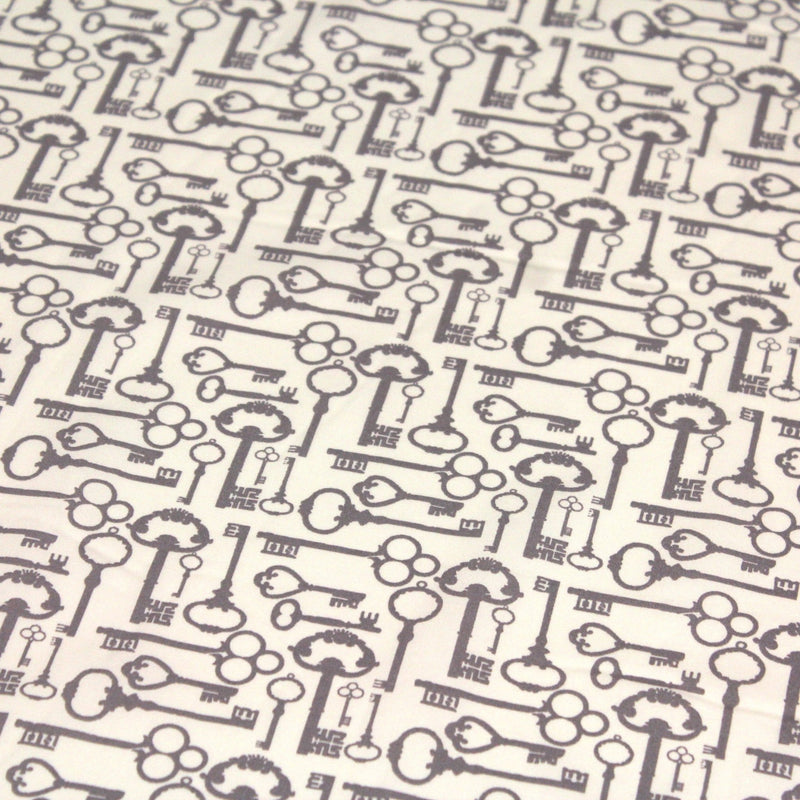 Tissu popeline de coton aux clefs vintage taupe, fond écru - tissuspipi.com