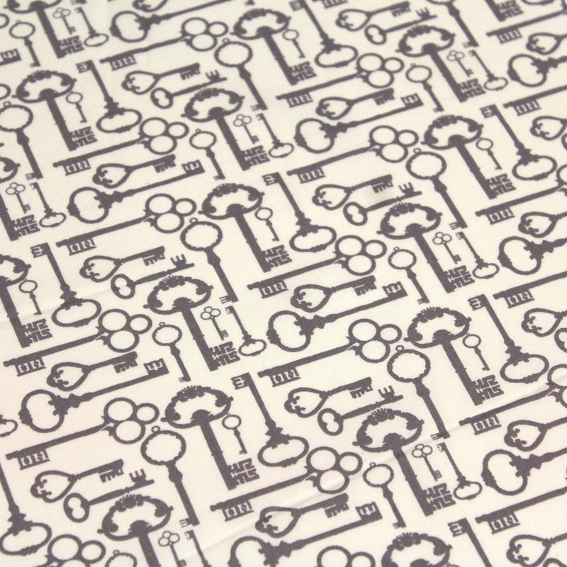 Tissu popeline de coton aux clefs vintage taupe, fond écru - tissuspipi.com