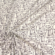 Tissu popeline de coton aux clefs vintage taupe, fond écru - tissuspipi.com