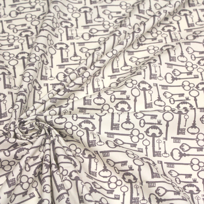 Tissu popeline de coton aux clefs vintage taupe, fond écru - tissuspipi.com