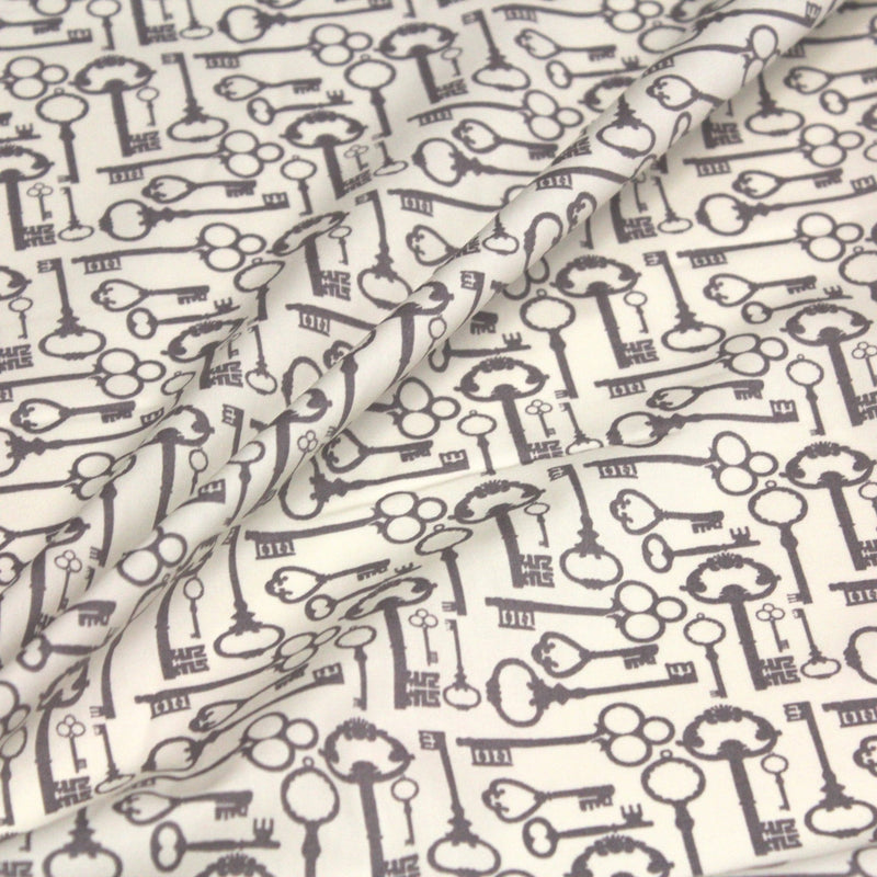 Tissu popeline de coton aux clefs vintage taupe, fond écru - tissuspipi.com