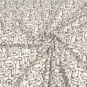 Tissu popeline de coton aux clefs vintage taupe, fond écru - tissuspipi.com