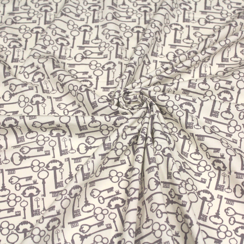 Tissu popeline de coton aux clefs vintage taupe, fond écru - tissuspipi.com