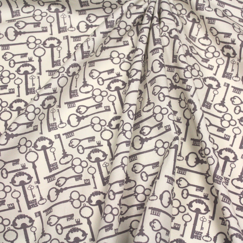 Tissu popeline de coton aux clefs vintage taupe, fond écru - tissuspipi.com