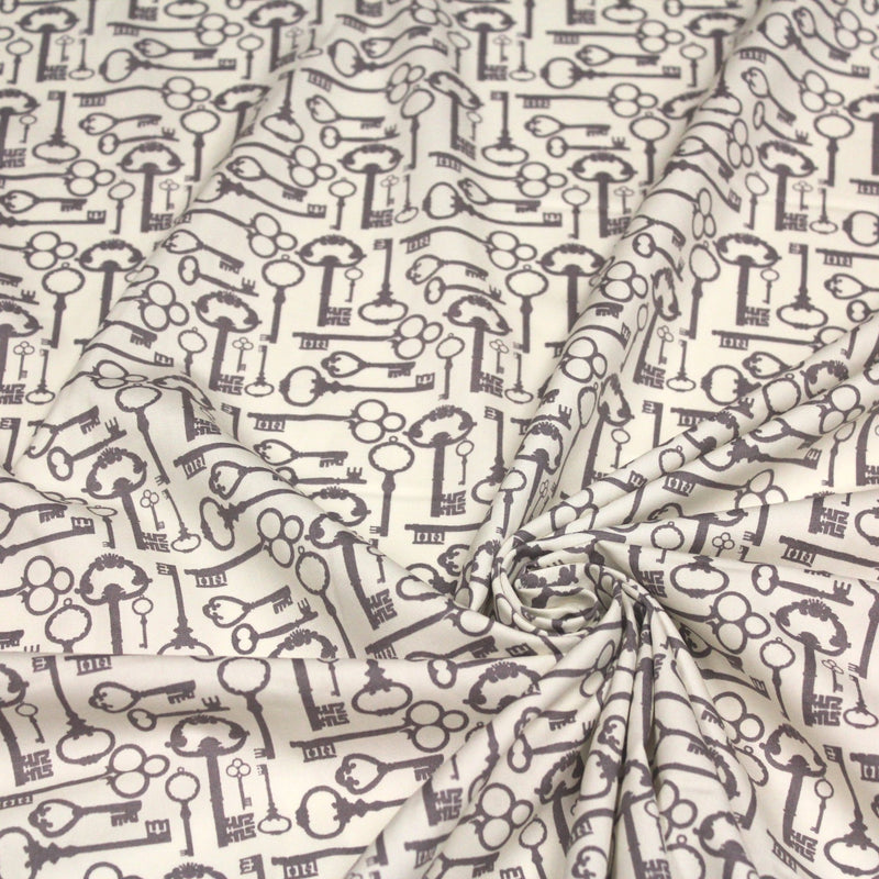 Tissu popeline de coton aux clefs vintage taupe, fond écru - tissuspipi.com